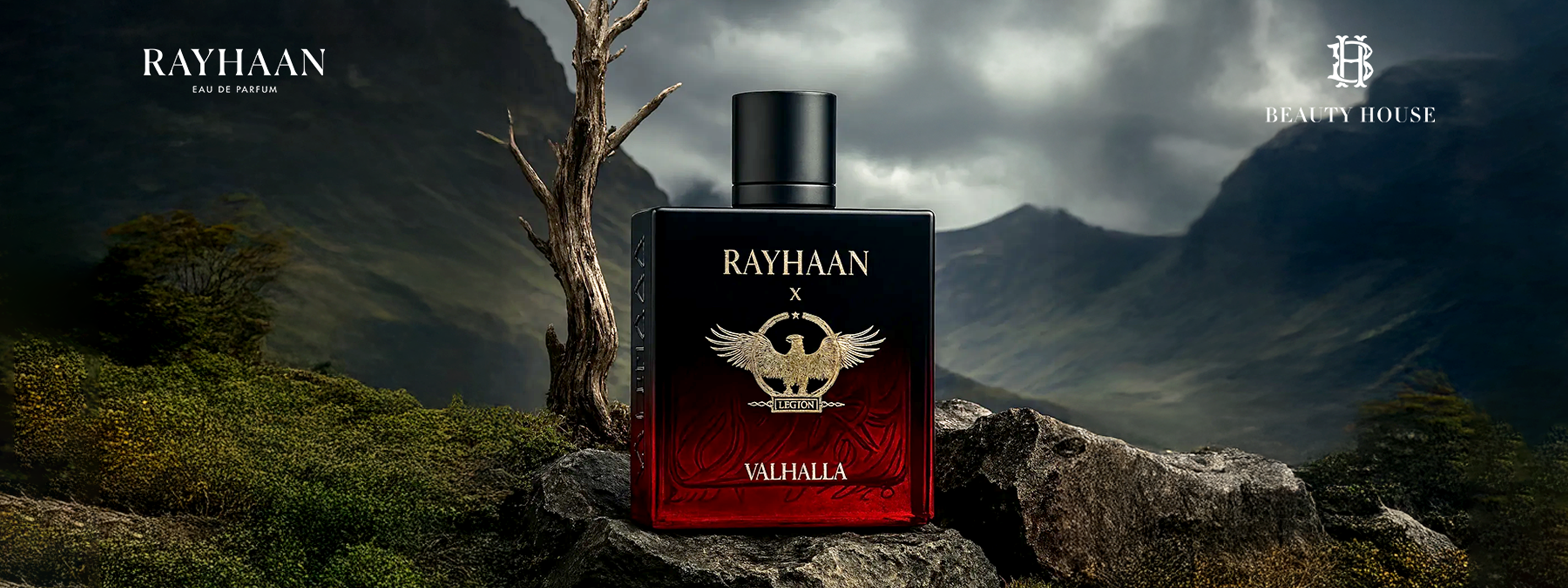 Rayhaan Valhalla perfume bottle with eagle emblem on rocky mountain backdrop.