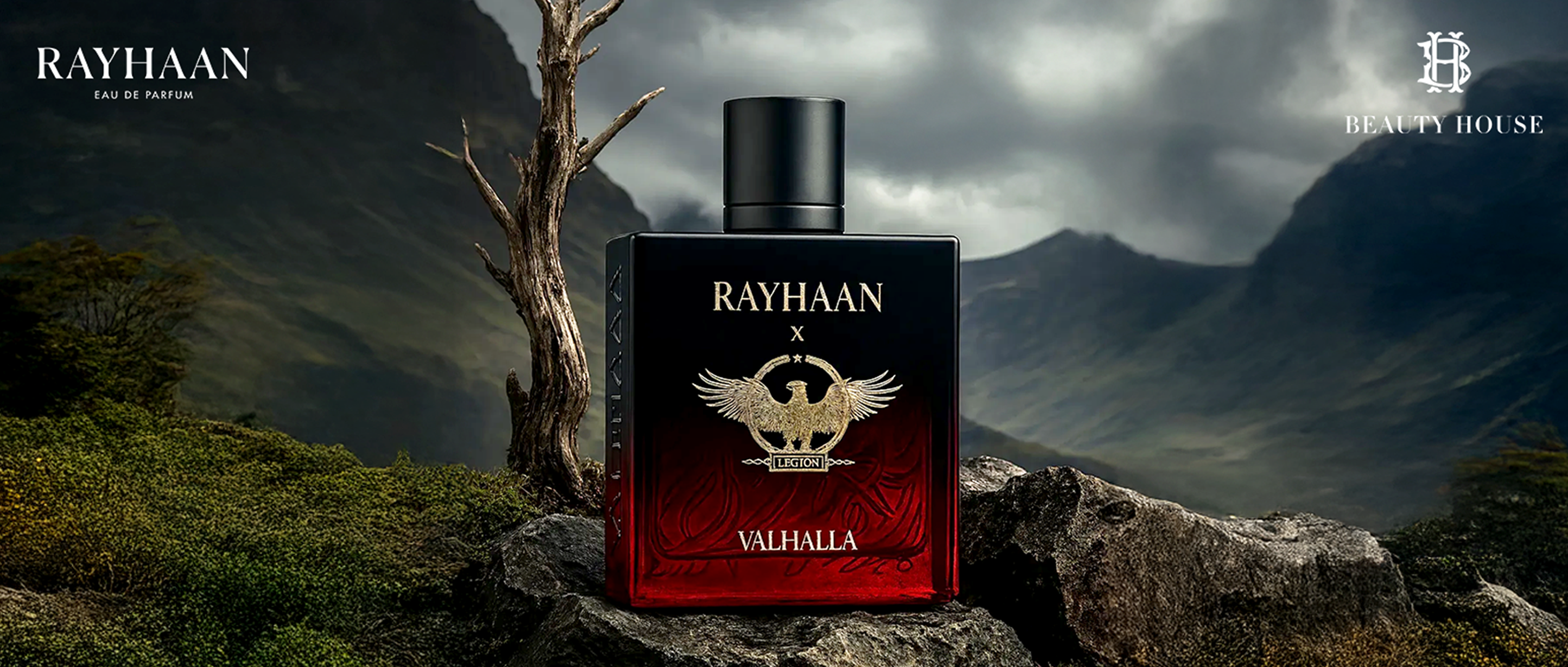 Rayhaan Valhalla perfume bottle with eagle emblem on rocky mountain backdrop.