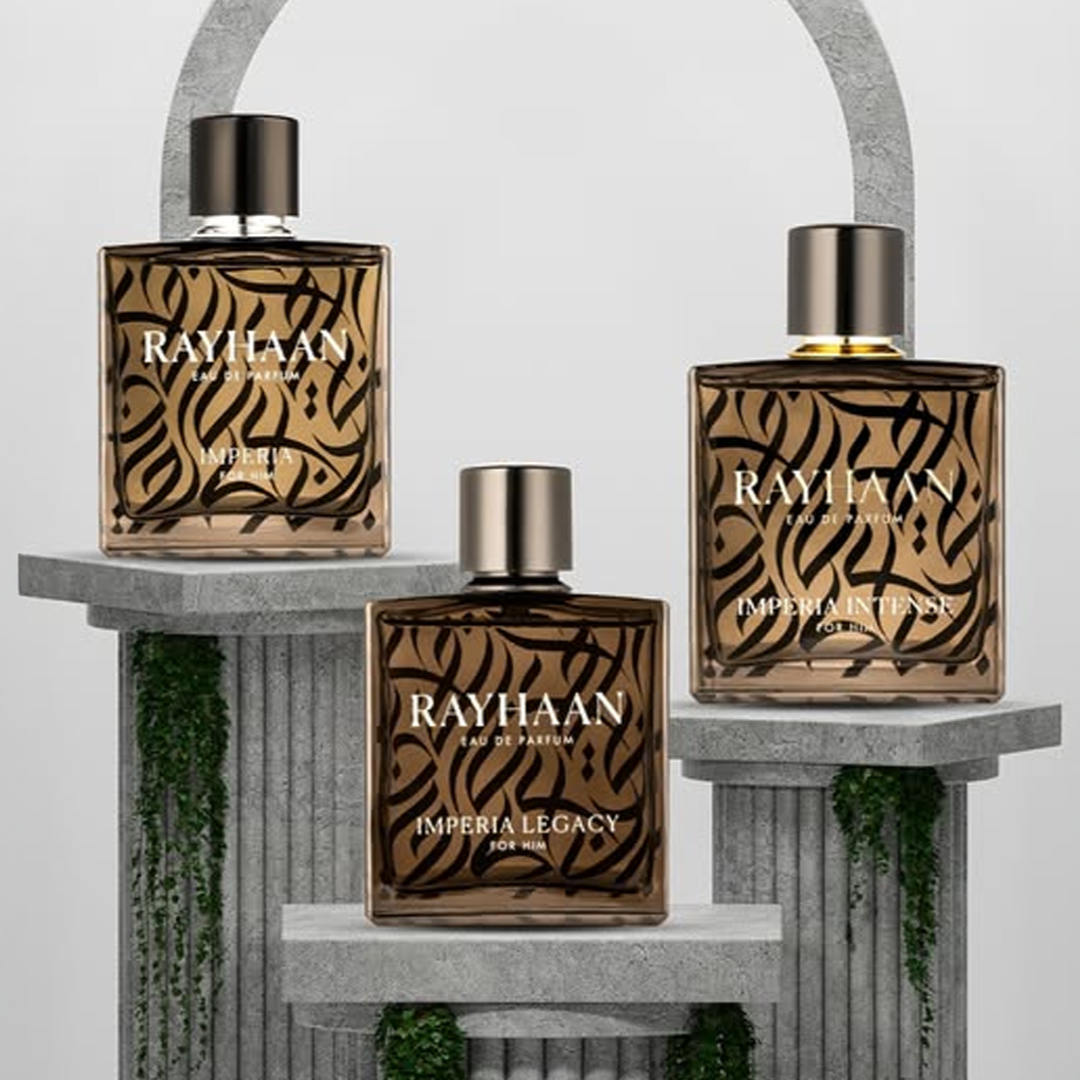 Three Rayhaan perfume bottles — Imperia, Imperia Intense, and Imperia Legacy — displayed on stone pillars with green vines, exuding a luxurious and sophisticated style.
