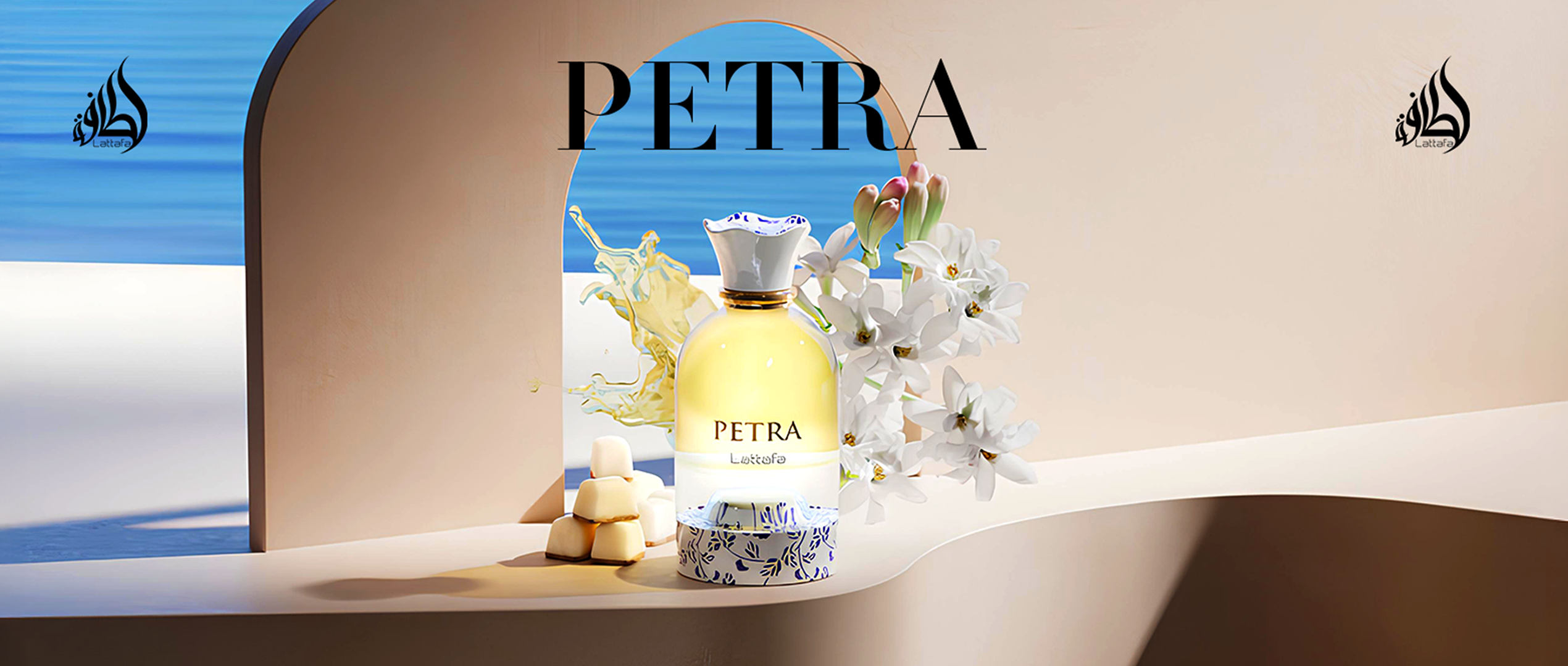 Lattafa Petra perfume bottle with white floral accents and caramel cubes, placed in front of an arch with a view of the ocean and blue sky.