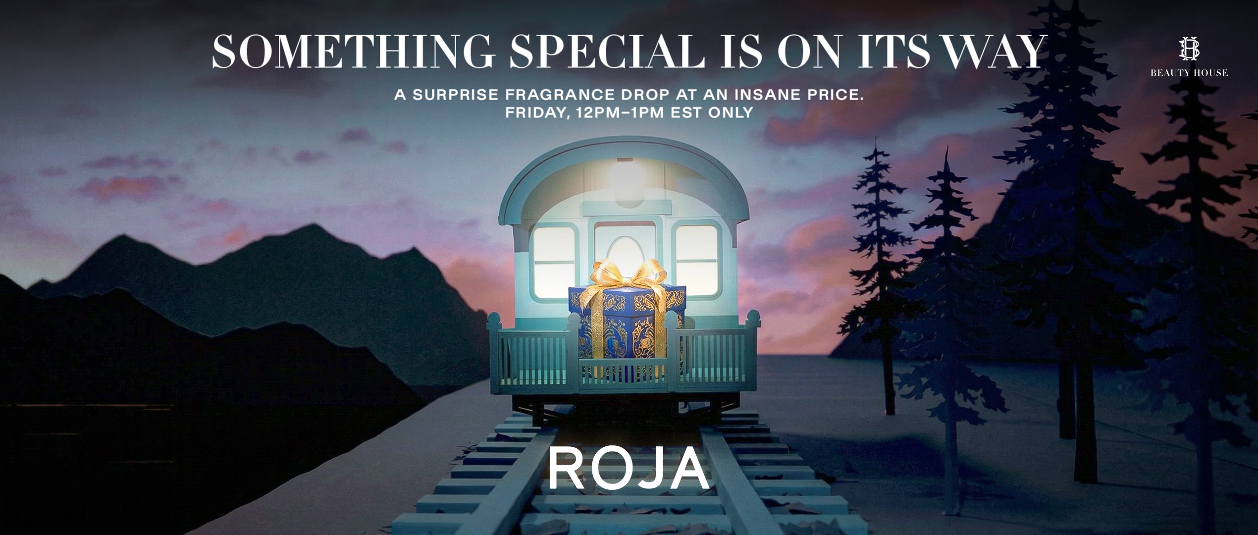 Roja mystery fragrance banner showing a glowing gift box inside a small train cabin on railway tracks at dusk, surrounded by mountains and trees. Text reads ‘Something Special Is On Its Way – A Surprise Fragrance Drop at an Insane Price, Friday 12PM–1PM EST Only,’ with Beauty House branding.