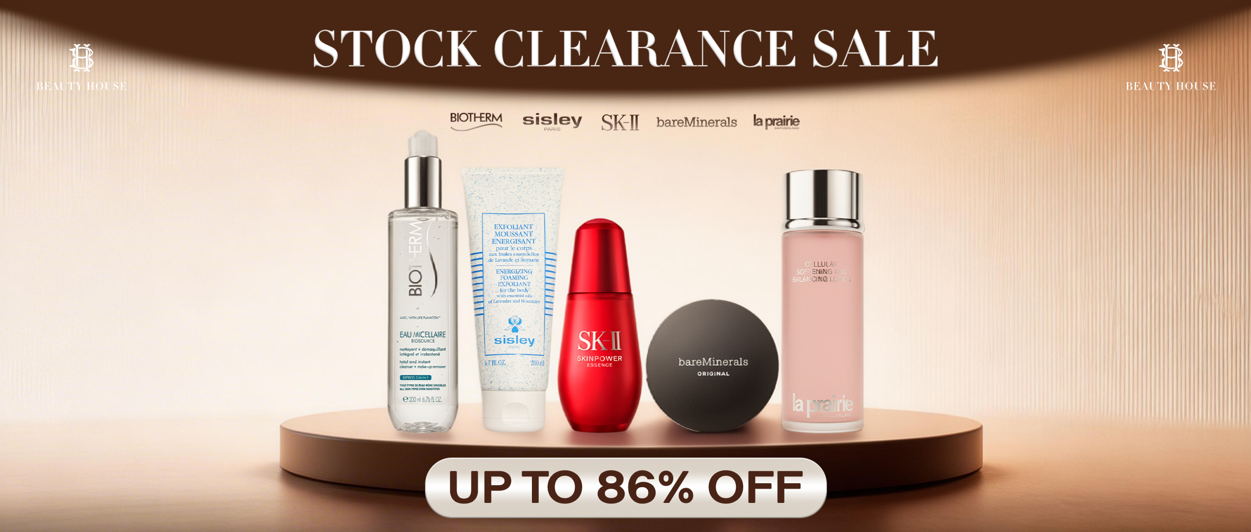Stock clearance sale banner featuring beauty and skincare products from Biotherm, Sisley, SK-II, bareMinerals, and La Prairie displayed on a podium, with text reading ‘Stock Clearance Sale – Up to 86% Off’ and Beauty House branding.