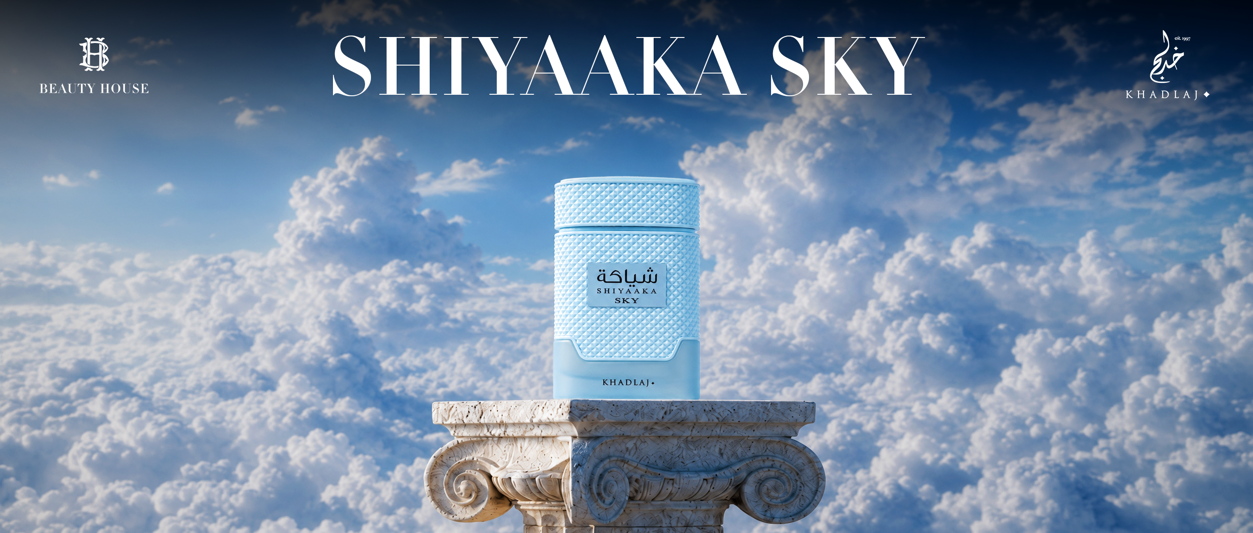Khadlaj Shiyaaka Sky fragrance banner featuring a light blue perfume bottle on a marble pedestal above the clouds with a serene sky backdrop.