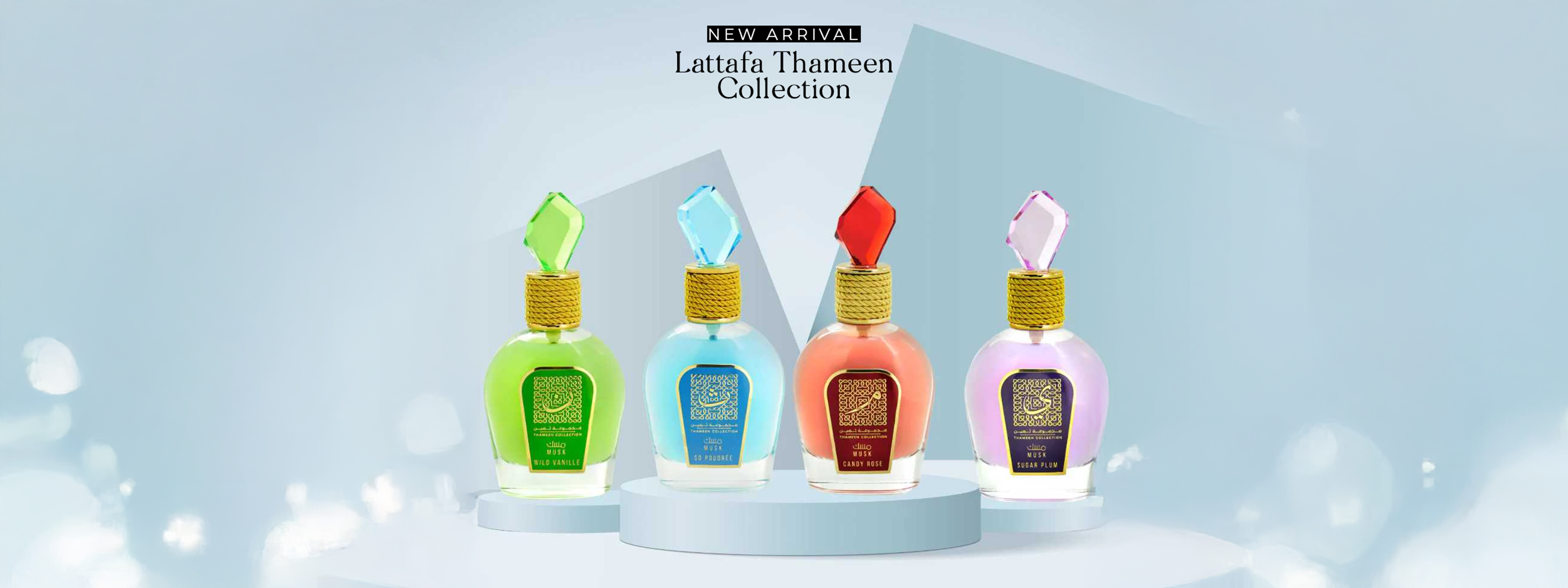 Lattafa Thameen Collection new arrival – colorful perfume bottles Wild Vanille, So Poudree, Candy Rose, and Sugar Plum displayed on podium with luxury background.