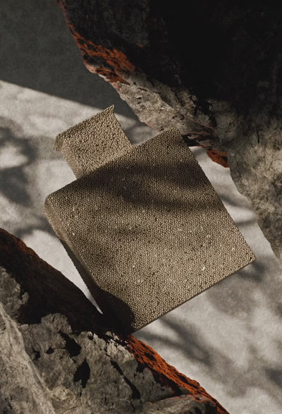 A warm-toned video showing a Rayhaan perfume bottle named ‘Terra.’ The bottle stands on textured sand under golden light as the Rayhaan logo appears, creating an elegant, earthy atmosphere
